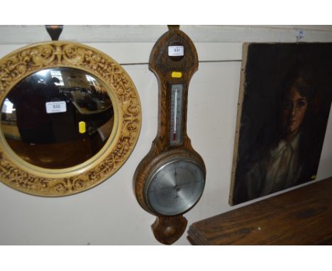 An oak cased barometer 