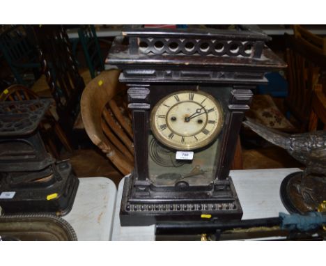 A late Victorian two hole mantel clock
