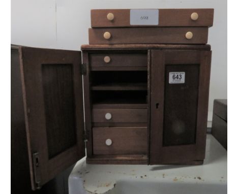 Five drawer watchmakers tool cabinet containing a large amount of tools, screwdrivers