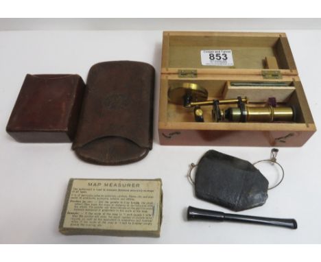 A brass pocket microscope in fitted wooden box with two glass slides;  a map measurer in box; a pair of pince nez in case, ci