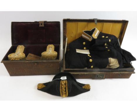 A Royal Navy dress and full dress uniform includes belt with gilt metal buckle, epaulettes, bicorn hat, gold bullion epaulett
