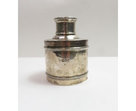 A silver tea caddy, makers mark worn, London 1912, of plain cylindrical form with an inscribed pull off cover, 9 cm high, 84 