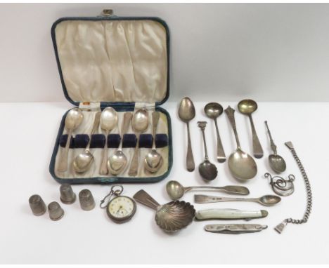 A cased set of six silver tea spoons; a Georgian style silver caddy spoon; three antique silver cruet spoons; a Georgian silv