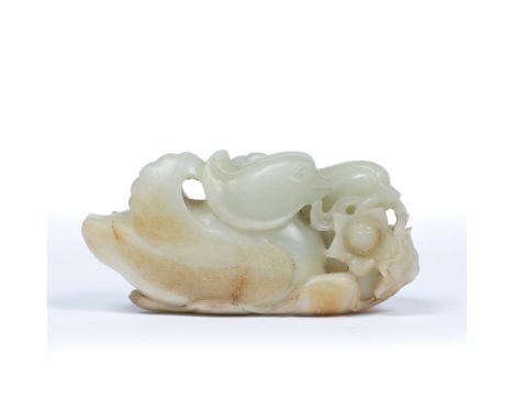 Mutton fat and rust tinted jade boulder Chinese, 18th/19th Century carved as a brace of Mandarin ducks with detailed wings an