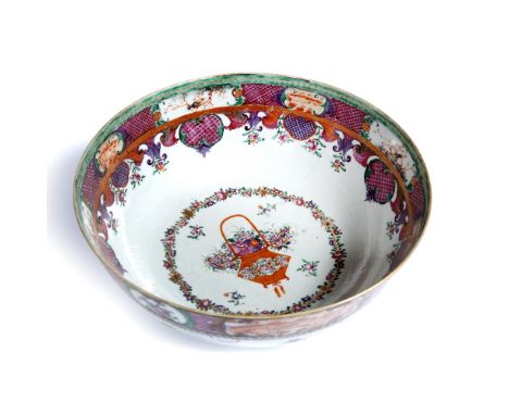 Famille rose bowl Chinese, circa 1800 painted with a central vase of flowers and with panel border 29cm