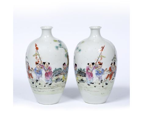 Pair of ovoid vases Chinese, Republic Period (1912 - 1949) decorated in polychrome depicting children in a garden with kites,