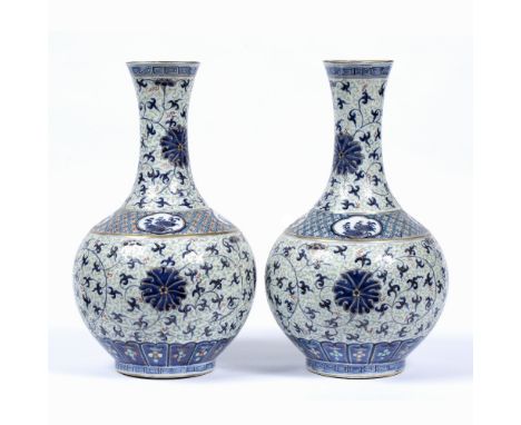 Pair of vases Chinese, 19th Century decorated in polychrome colours with Indian lotus decoration, the bases with Kangxi mark 