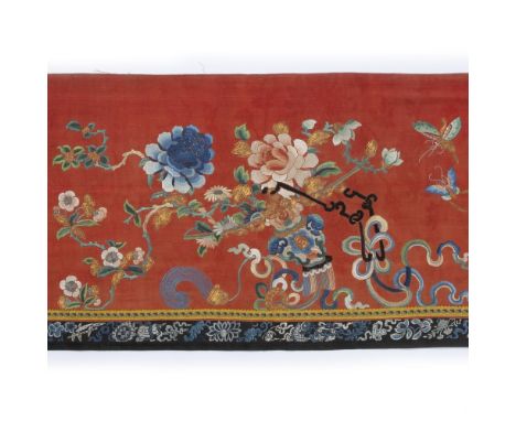 Red silk panel with Peking knot Chinese with central peony, butterflies and other flowers, with black panelled border 210cm x