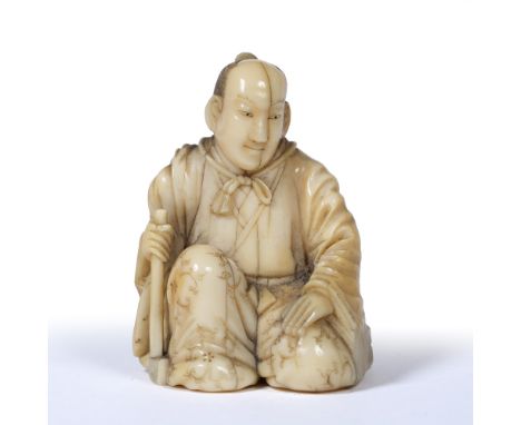 Well carved okimono of a priest Japanese, Mid Meiji dressed in long floral decorated robes while squatting holding a mallet s