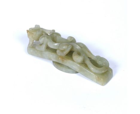 Olive green jade belt buckle Chinese pierced and carved with a writhing dragon 8cm x 2cm
