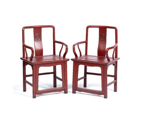 Pair of red lacquer southern official's hat chairs Chinese, Ming style each with a symbol to the back panel  64cm across, 99c