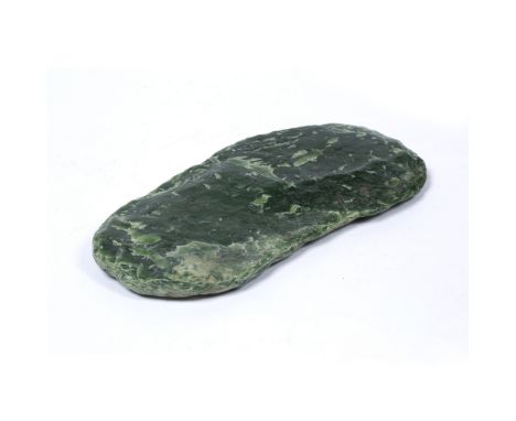 Jadeite boulder New Zealand of irregular oval flattened form with striations 31cm x 14cm approx