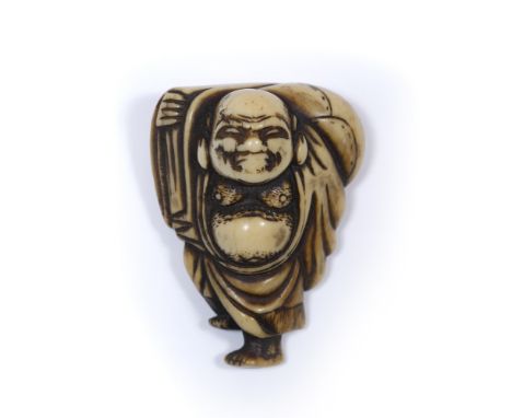 Ivory netsuke of Hotei Japanese, Edo Period carrying his sack over his right shoulder while standing on one leg, Kyoto school