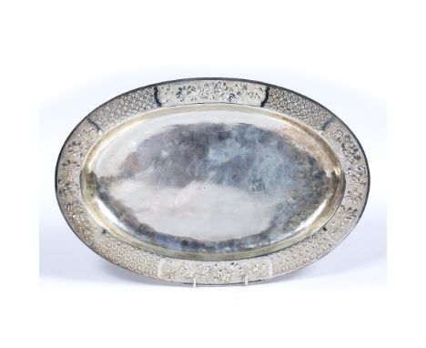 Silver tray Chinese, 19th/20th Century of oval form, the border decorated with stylised flowers, with impressed mark to base,