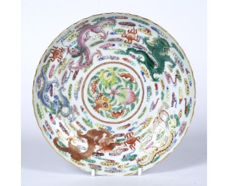 Porcelain plate Chinese decorated in polychrome colours depicting dragons in flight with a central panel of plum blossom, wit