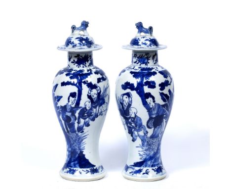 Pair of blue and white baluster vases and covers Chinese, 19th Century each painted with Long Eliza, Kangxi marks and kylin f