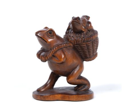 Wood netsuke of a frog walking as a human Japanese, mid Meiji carrying two infants upon a basket on his back, on oval base, s