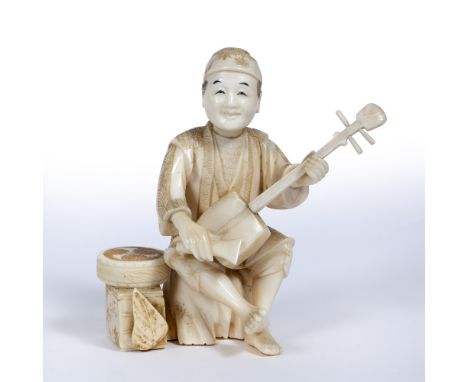 Ivory okimono Japanese, late Meiji in the form of a lute player seated on a tree stump, signed Shiko 11.5cm high