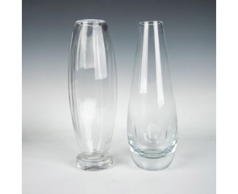 These two gorgeous clear crystal vases boast a sleek modern look. One is decorated with simplistic side cuts, while the other