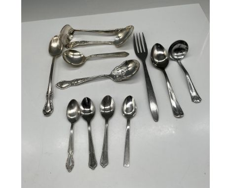 Variety of metal utensils including - 4 sugar spoons 4.5", small ladle spoon with engraved flowers 6", 3-sauce serving spoons