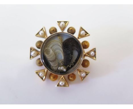 A Victorian Hair and Seed Pearl Memorial Brooch in a precious yellow metal setting with a fitted case, 27 mm, 7.8 g