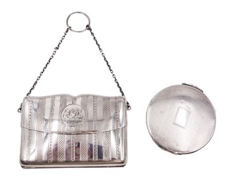 Early 20th century silver mounted coin purse, with engraved linear decoration and engraved circular panel to centre of hinged