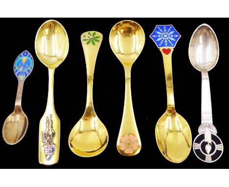 Six Danish silver and silver-gilt year spoons, including four example by Anton Michelsen, each with enamel decoration, includ