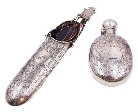 Victorian silver hip flask, of oval form, with engraved foliate and scroll decoration, and monogrammed shield shaped cartouch