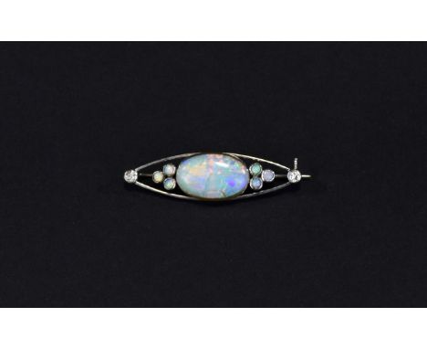 White Gold Opal Bar Brooch, Large Central Oval Opal Set Between Six Further Opals And Two Round Cut Diamonds. (Opal Cracked A