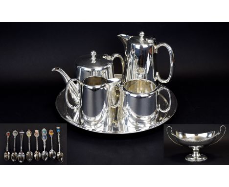 Silver Plated Sugar Bowl. Teapot, Water Jug, Milk Jug and Circular Tray Together with a centre piece and 8 souvenir spoons - 