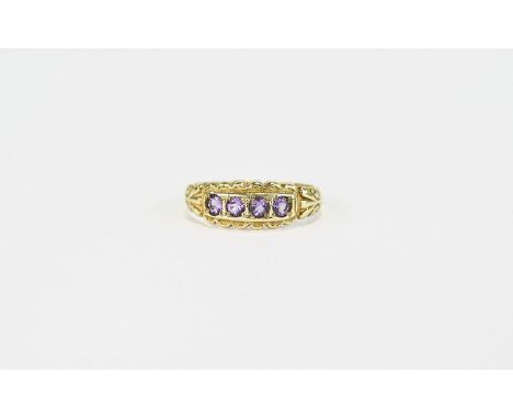 Amethyst and 9ct Gold Ring, a row of four round cut amethysts, each in a square frame, between scalloped edges, in 9ct gold; 