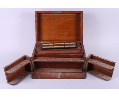 A figured oak games compendium, including cribbage, draughts, dominoes and dice, 12 1/2" wide