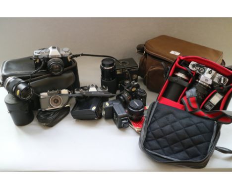 A collection of cameras and camera equipment, by Olympus, Minolta and others