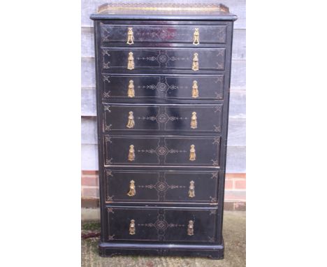 A late Victorian ebonised and gilt detailed chest of seven graduated long drawers, drawer stamped 8392, on bracket feet, 27" 