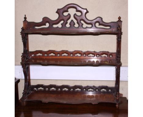 A 19th century rosewood three-tier open wall shelf, 26" wide