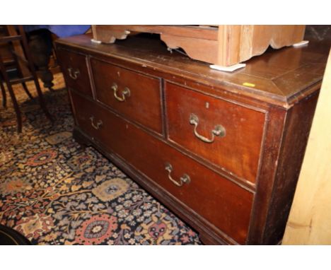 A low chest of three small and one long drawer, on bracket feet, 48" wide