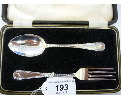 A silver Christening spoon and fork with bright-cut engraved stems  Birmingham 1934  cased     11