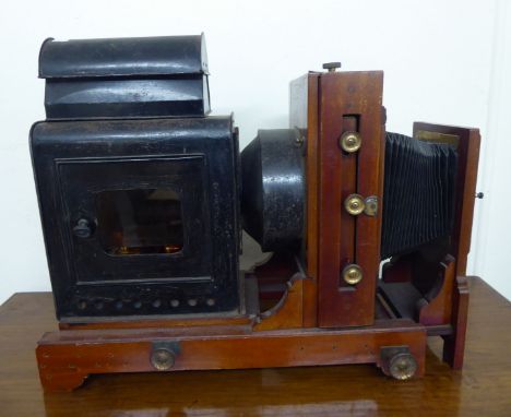 A late Victorian/Edwardian mahogany and black painted metal cased magic lantern with an adjustable front lens  20''h; and a c