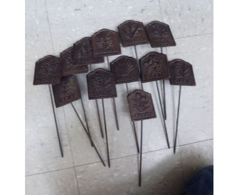 A set of twelve cast iron herb patch markers       OS9