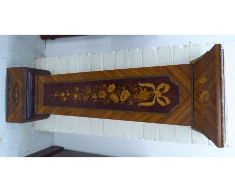 A 20thC Continental kingwood veneered floral and ribbon tied marquetry pedestal with gilt metal mounts, the top column raised