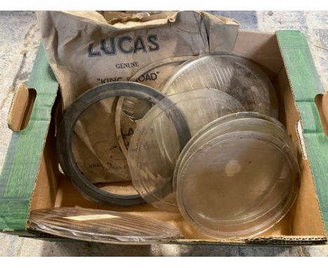 A small box of headlamp glasses, some in original packaging.