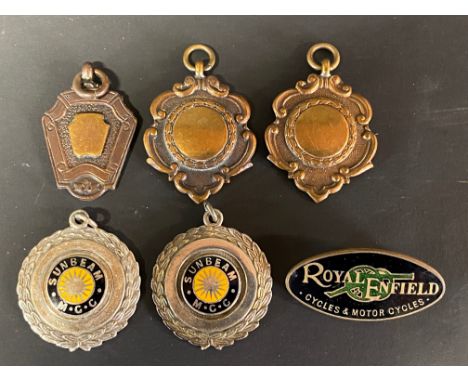 Four badges awarded to K.L.Denman including Sunbeam Motor Cycle Club, plus a Royal Enfield Cycles and Motor Cyces oval enamel