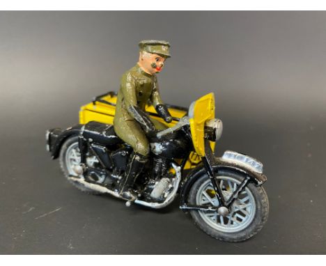 A small die-cast model of an AA motorcycle combination with rider, marked Made in England.