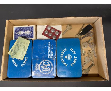 A selection of RAC collectables including buttons, playing cards, box keys and first aid tins.