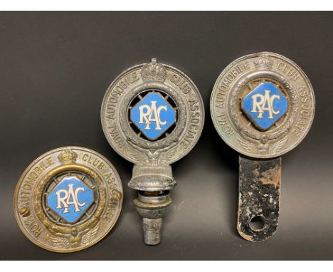 Three different version RAC Associate member badges, all with powder blue enamel centres.