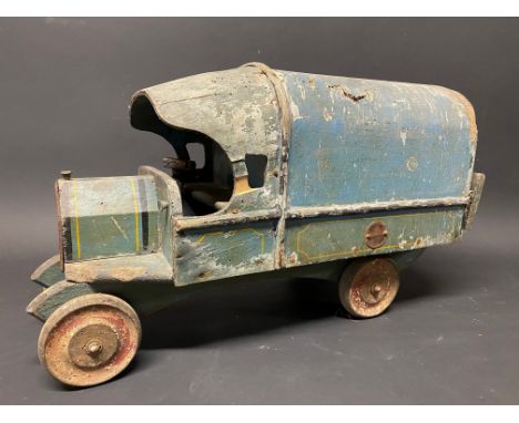 A primitive Tri-ang Toys wooden model of a believed WWI covered wagon.