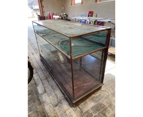 A large Victorian/Edwardian mahogany framed shop counter display cabinet, unusually having a high shelf, made by Glover, 70 1