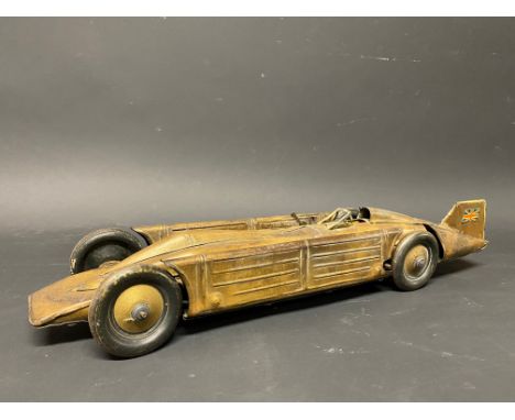 A clockwork tinplate model of Golden Arrow, the World Landspeed Record car.