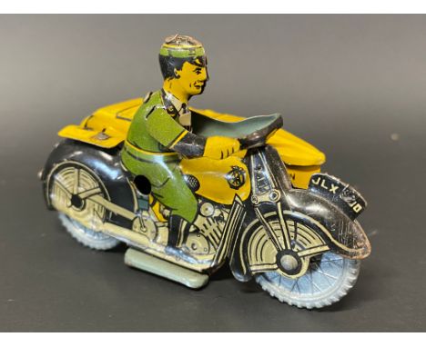 A small clockwork tinplate model of an AA motorcycle combination with rider, excellent condition.