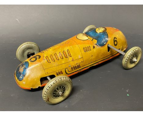 A Mettoy clockwork tinplate model of a single seater racing car.